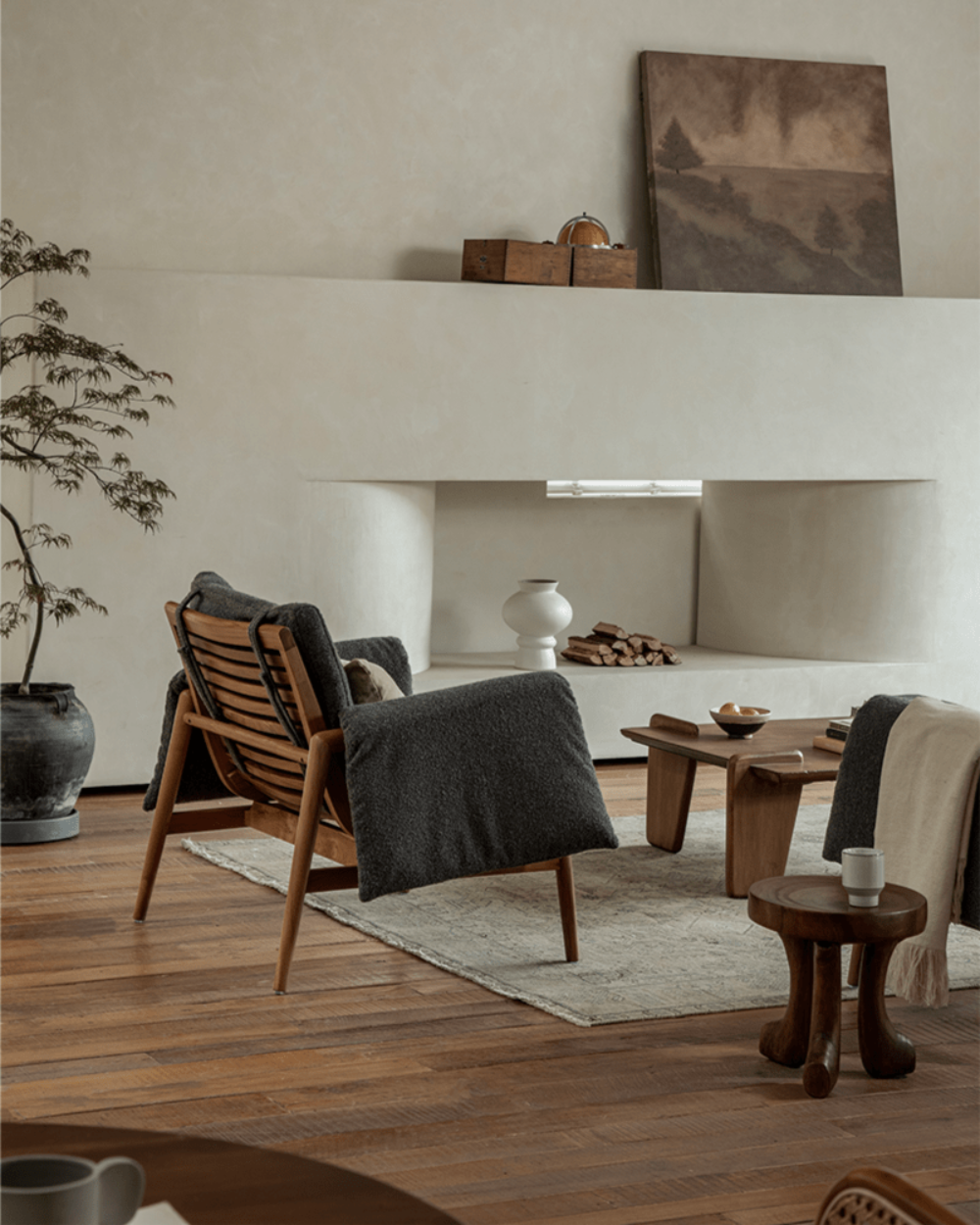 Teak wood garden lounge chair in modern living room, dark grey cushion, indoor comfort, wooden frame, stylish interior