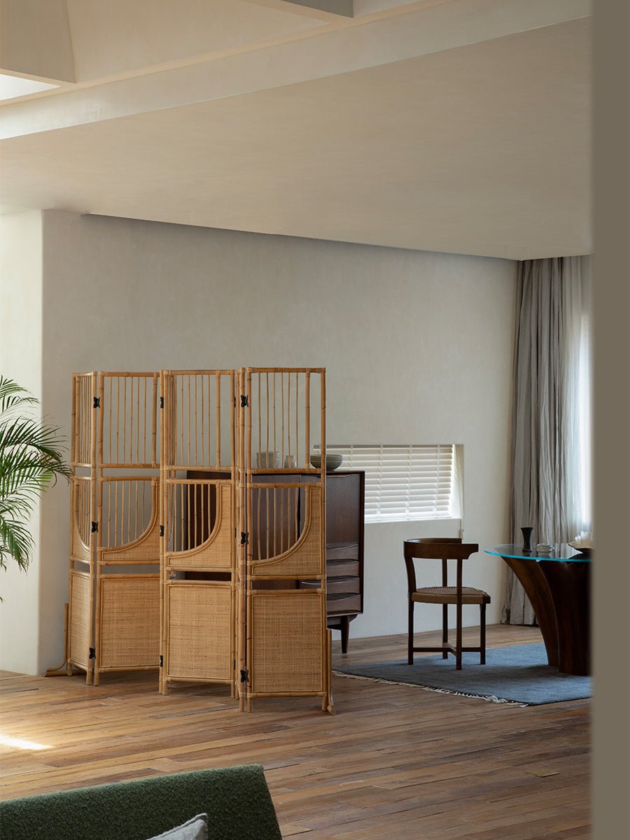 Sunlit four-panel Indonesian rattan screen room divider, minimalist interior design
