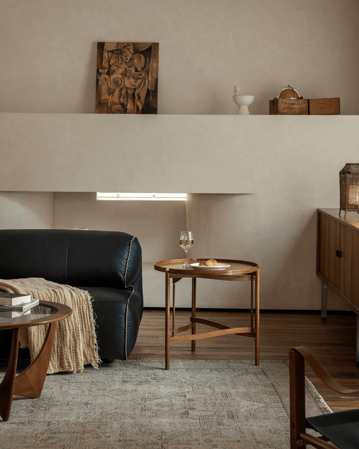 Hansen Tray Side Table in cozy modern living room with decor and light.