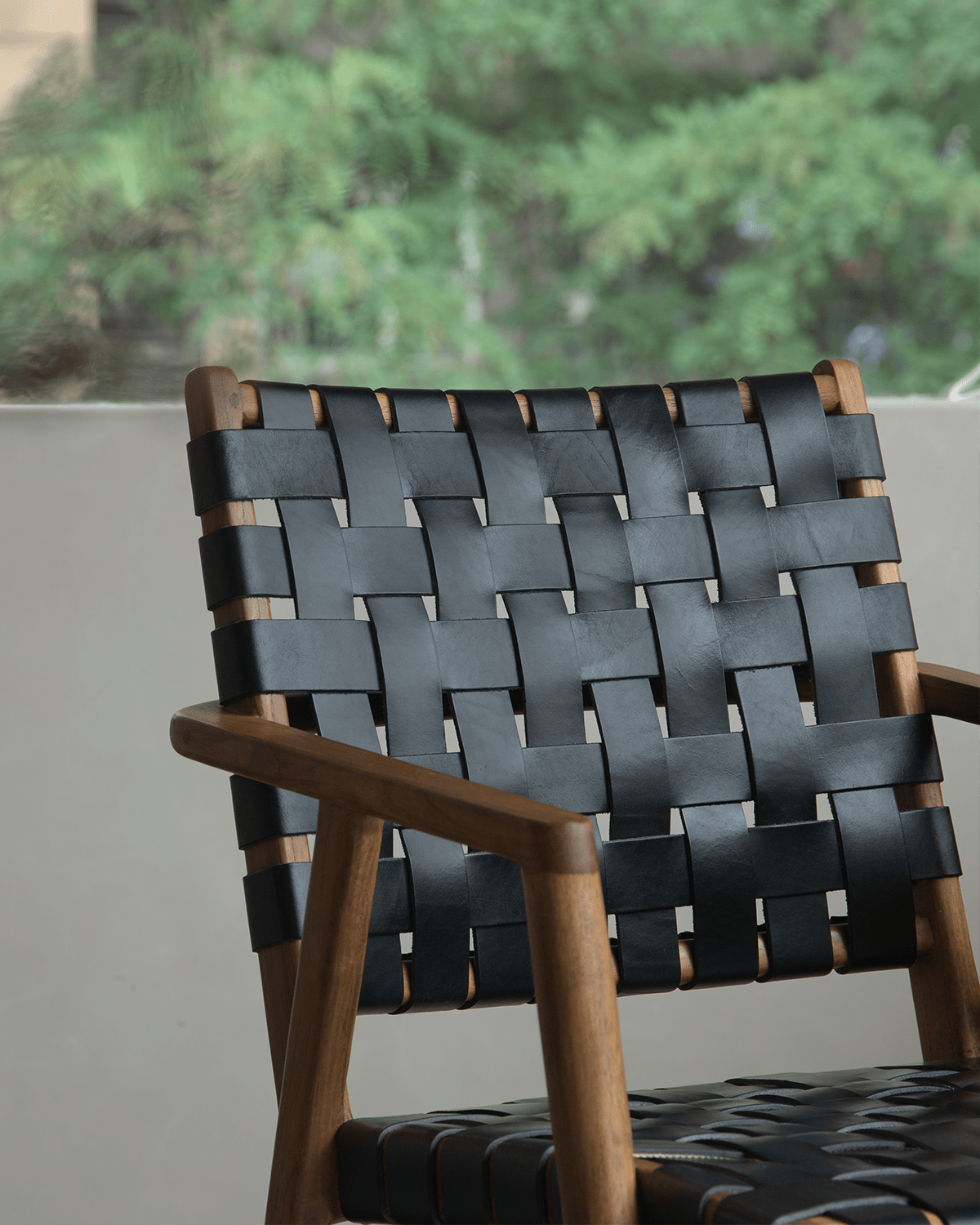 Louisa Chair with black leather woven seat and teak frame, Mid-Century Modern design for study or dining.