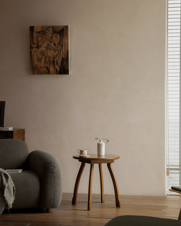 Elegant Ele Round Side Table with a minimalist vase in a stylish living room.