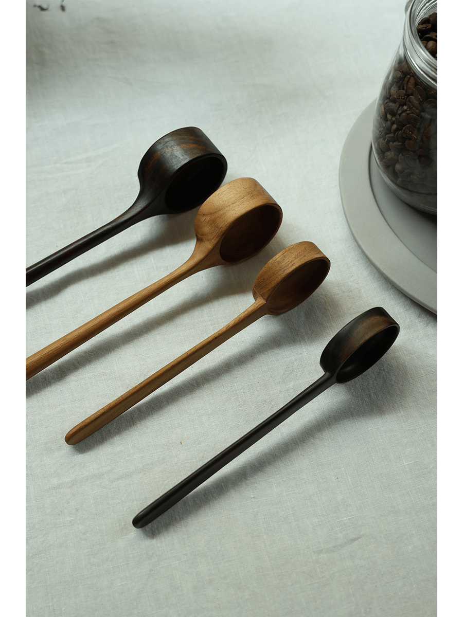 Teak coffee spoons in various shades, elegant design, ideal for coffee.