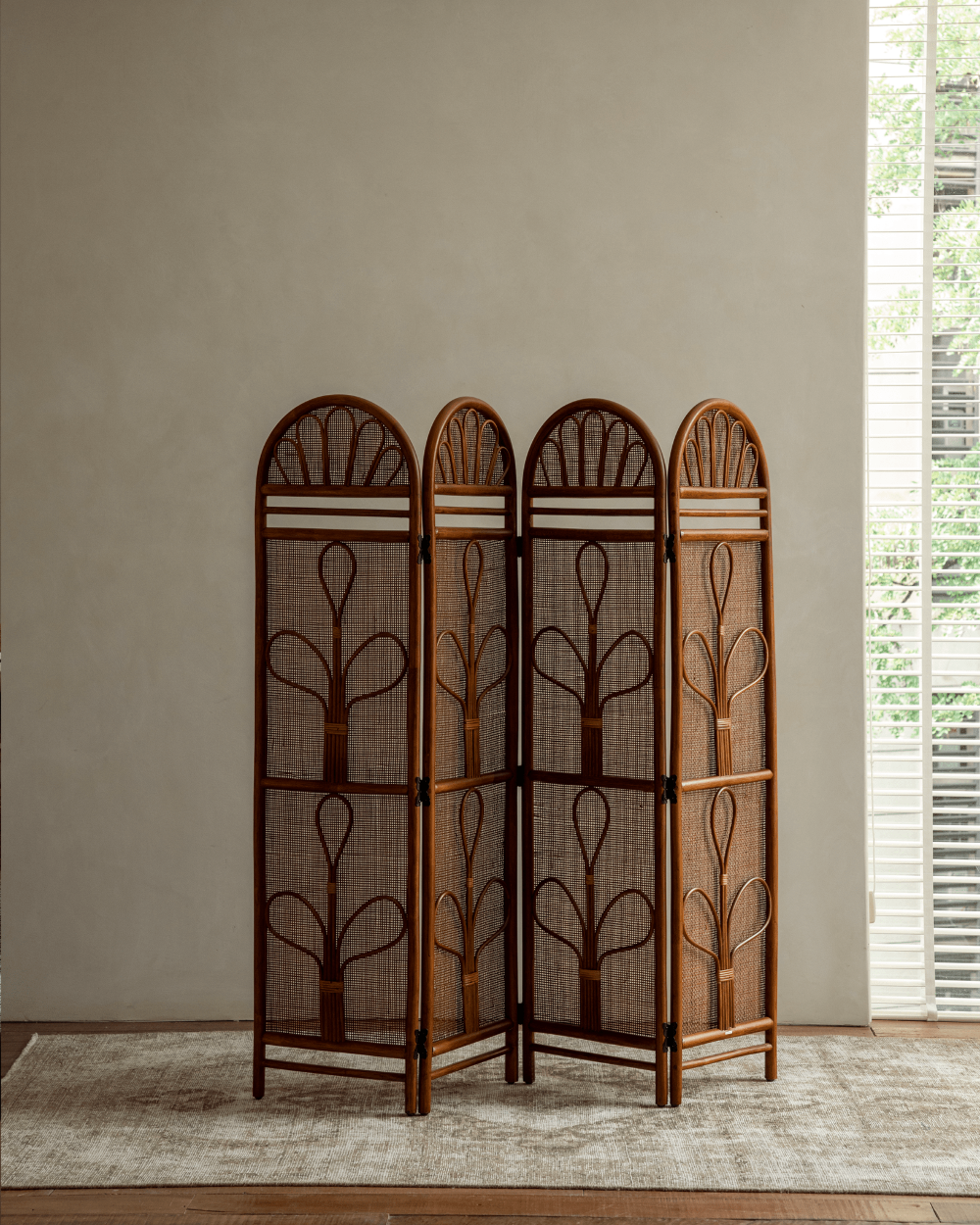 Natural GeTan Rattan Room Divider: Four woven panels with plant motifs and arched tops.