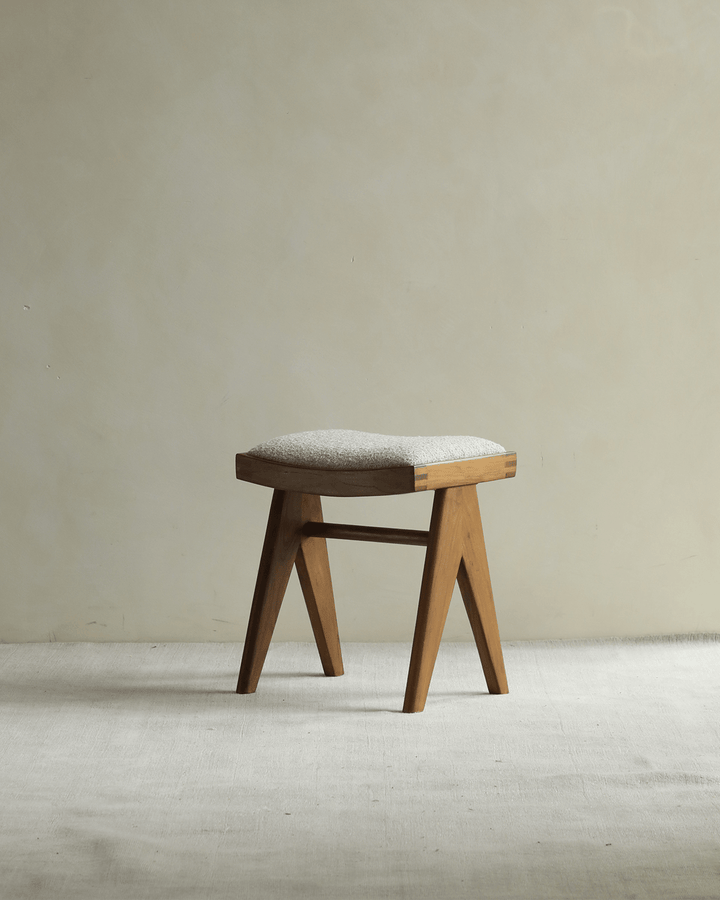 Chandigarh Easy Stool with teak wood frame and soft cushioned seat design.