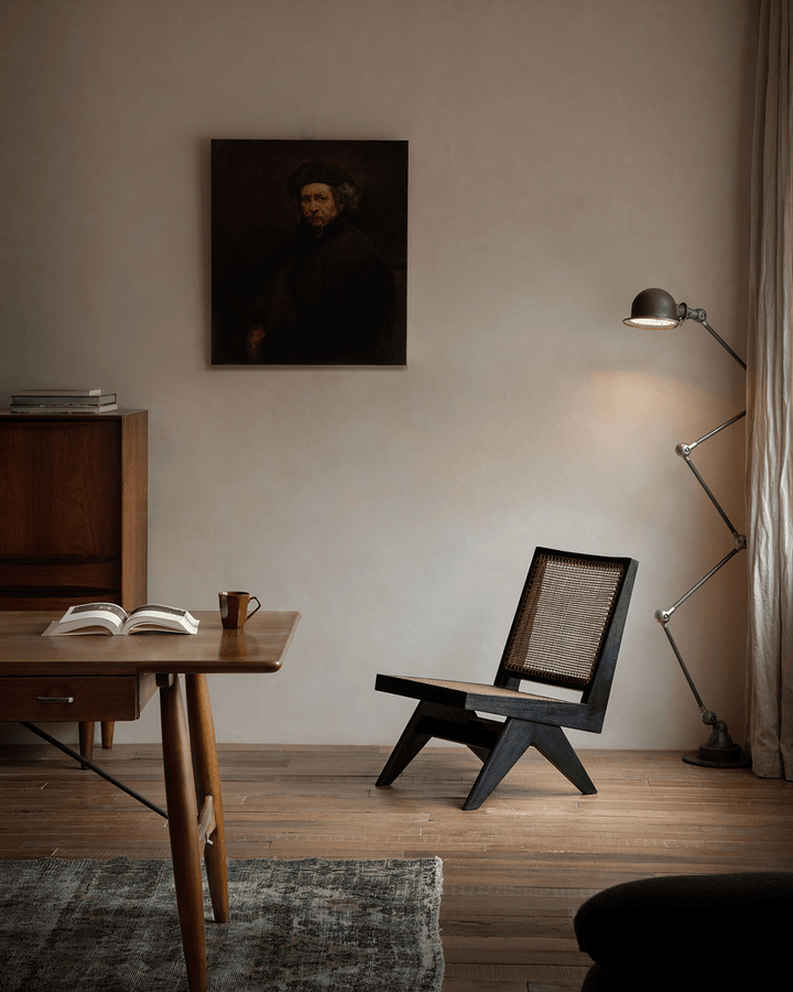 Chandigarh Armless Easy Chair with rattan backrest and modern decor setting