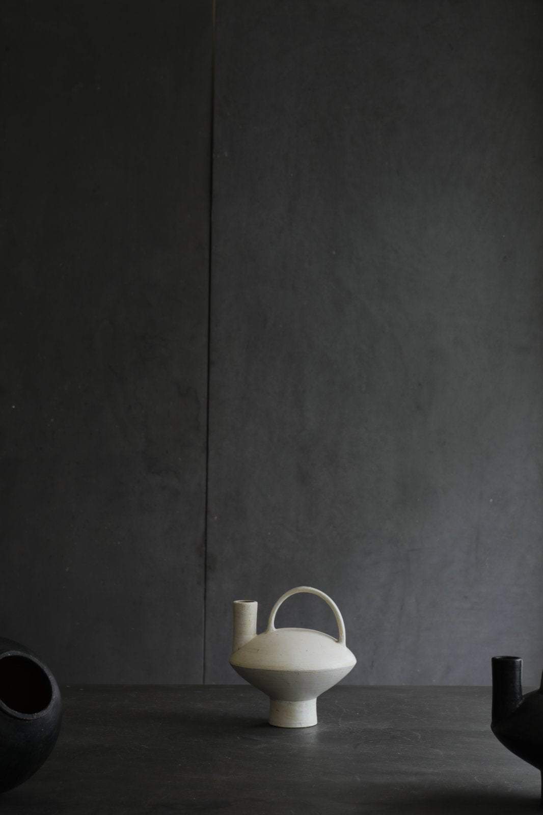 White ceramic vase with handle, modern design, home decor, black vase