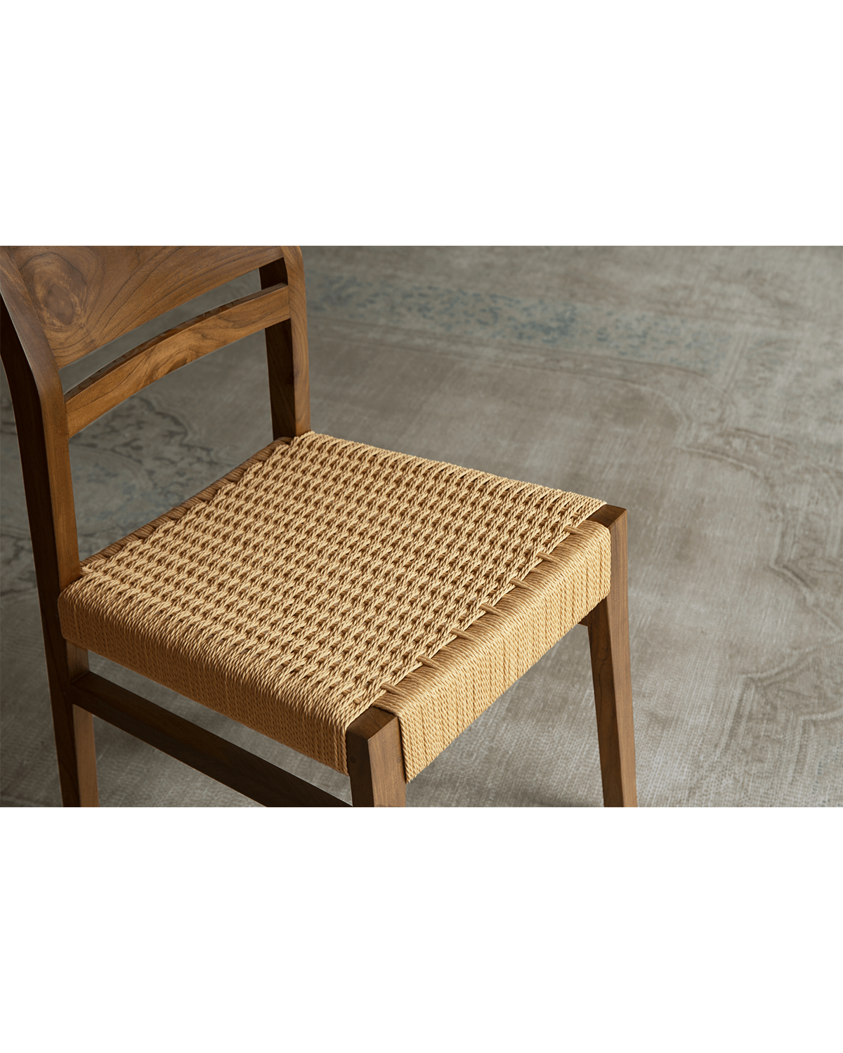 Beam Chair with woven kraft paper seat and teak wood frame, providing elegant comfort and style
