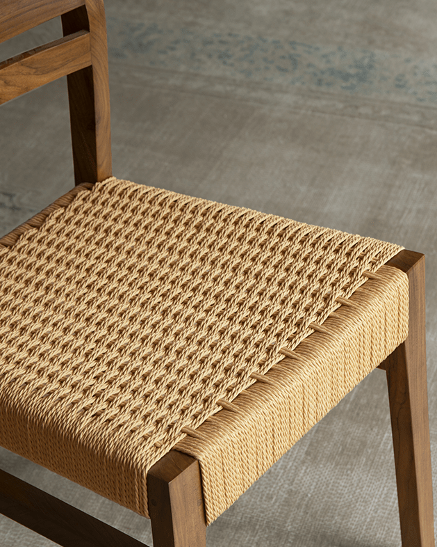Beam Chair with woven kraft paper seat and teak wood frame, providing elegant comfort and style