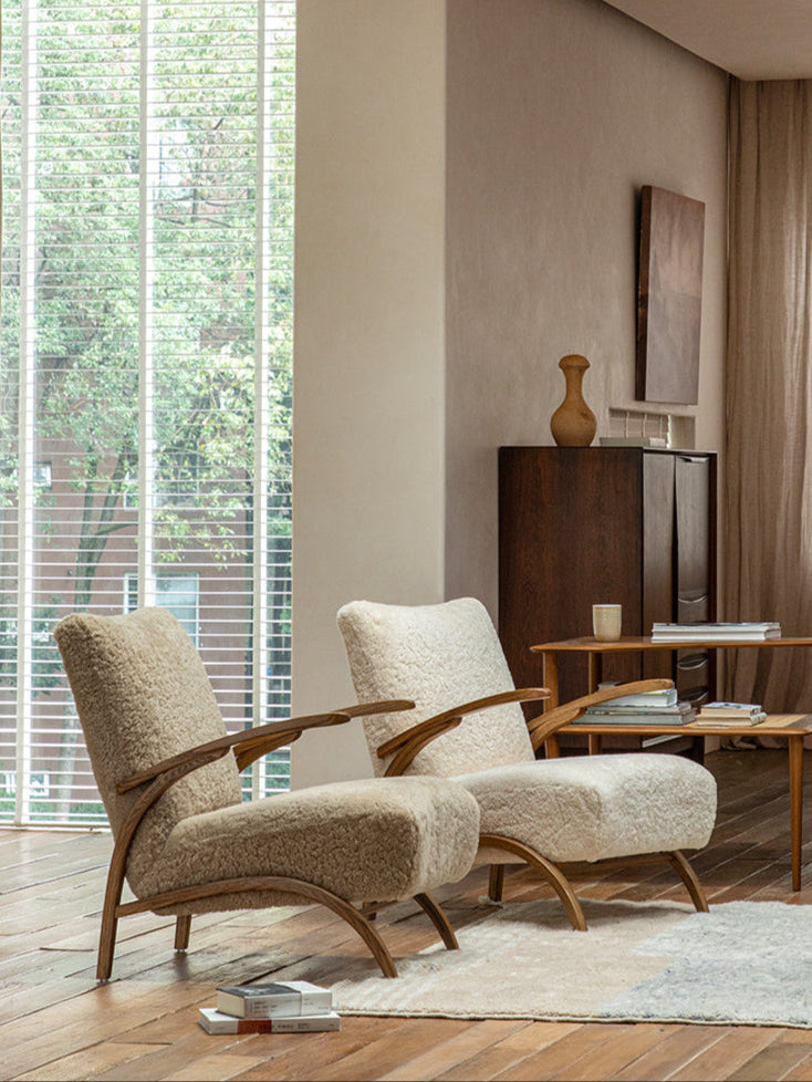 Nebula Lounge Chair in shearling upholstery with red oak frame, mid-century modern living room setting, cozy and comfortable.
