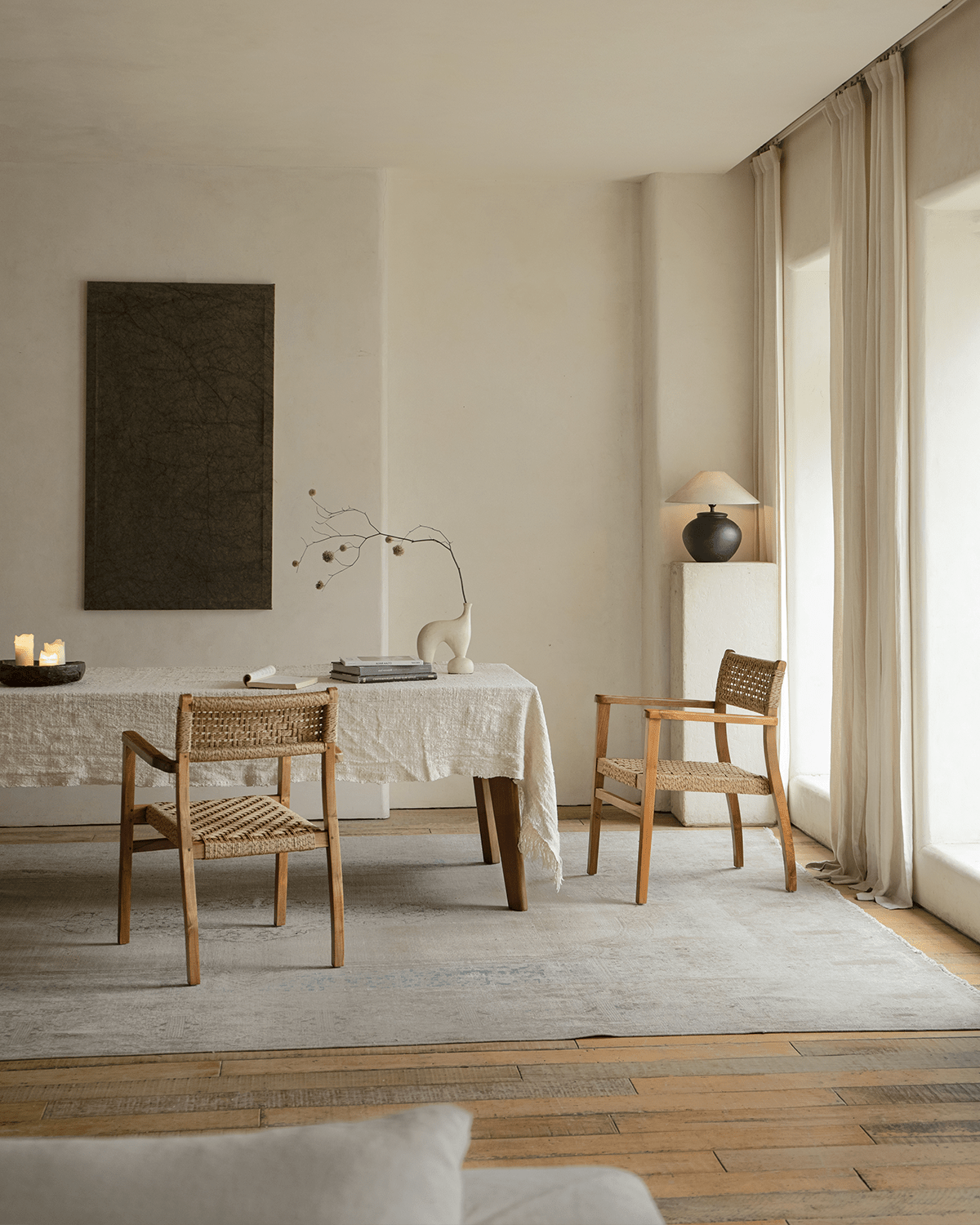 Reed Chair in a dining room setting, featuring teak frame and woven design, stylish and comfortable.