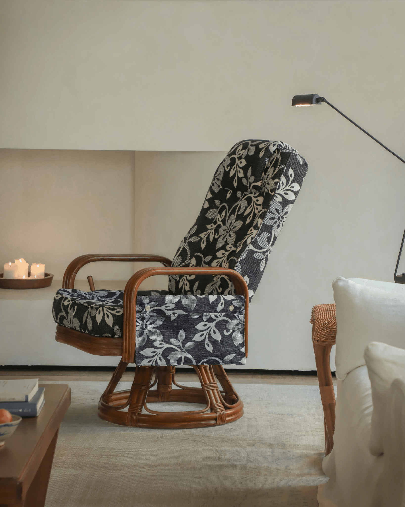 Willow Rattan Chair with floral cushions and Indonesian rattan frame in a cozy living room