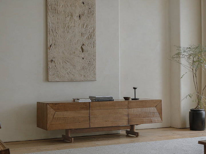 Handcrafted wooden sideboard with textured finish in modern minimalist living room