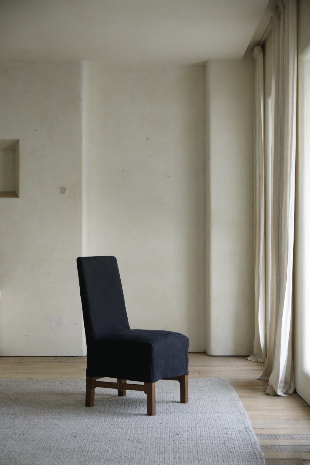Feast Dining Chair with dark blue linen slipcover, wood frame, modern dining room decor