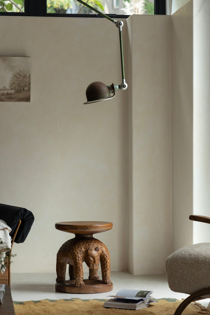 Handcrafted wooden Tribal Sculptural End Table with animal design, adding elegance to modern interiors.