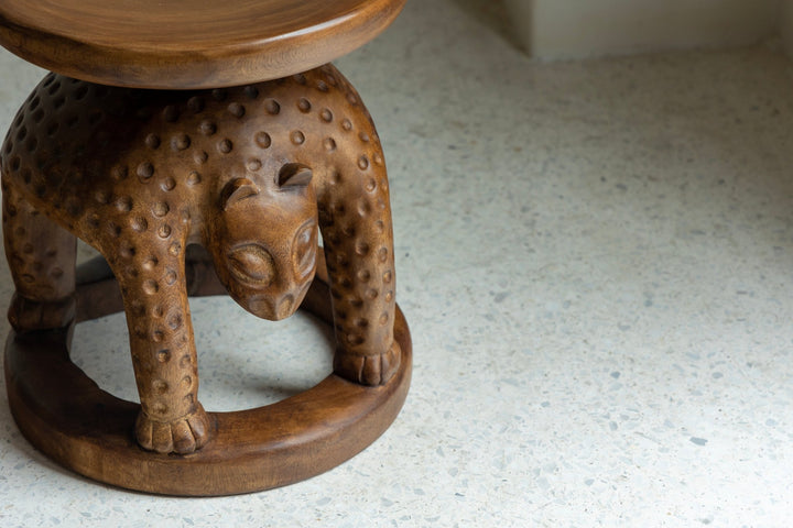 Artisan panther-shaped wooden Tribal Sculptural End Table enhancing modern interior decor.