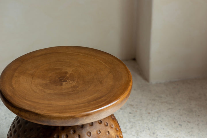 Top view of handcrafted wooden Tribal Sculptural End Table with smooth circular surface, ideal for home decor.