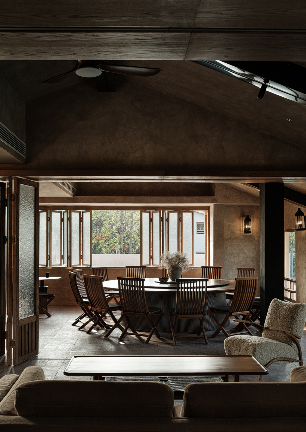 Dining area with round table and chairs in a modern interior setting.