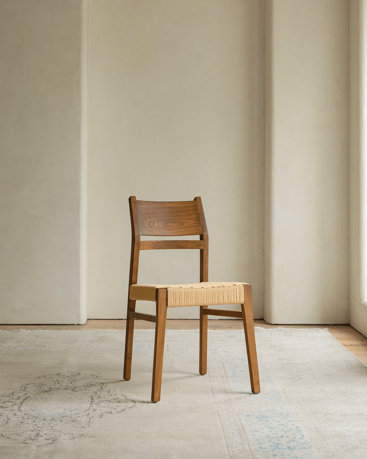 Beam Chair with Teak Wood Frame and Woven Seat. Perfect for adding natural warmth to any room.