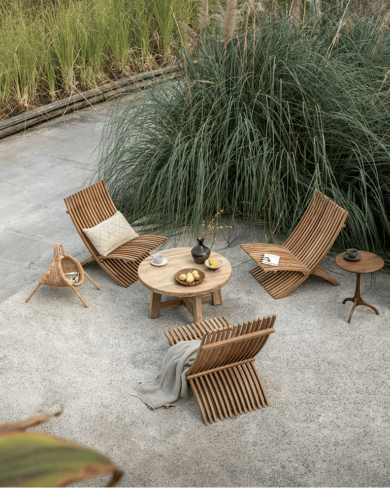 Oly Lounge Chairs in a serene outdoor setting, wooden slatted design, ergonomic and stylish seating