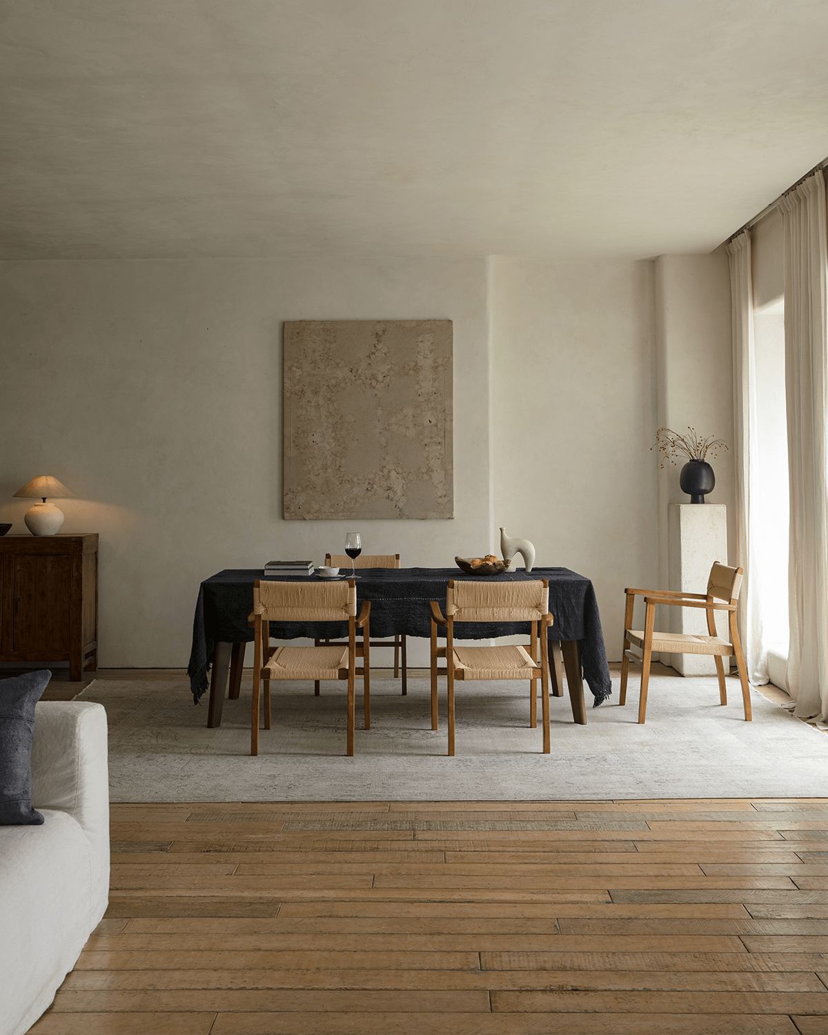 Reed Chair dining room setting with teak and woven seat. Stylish and comfortable dining furniture.