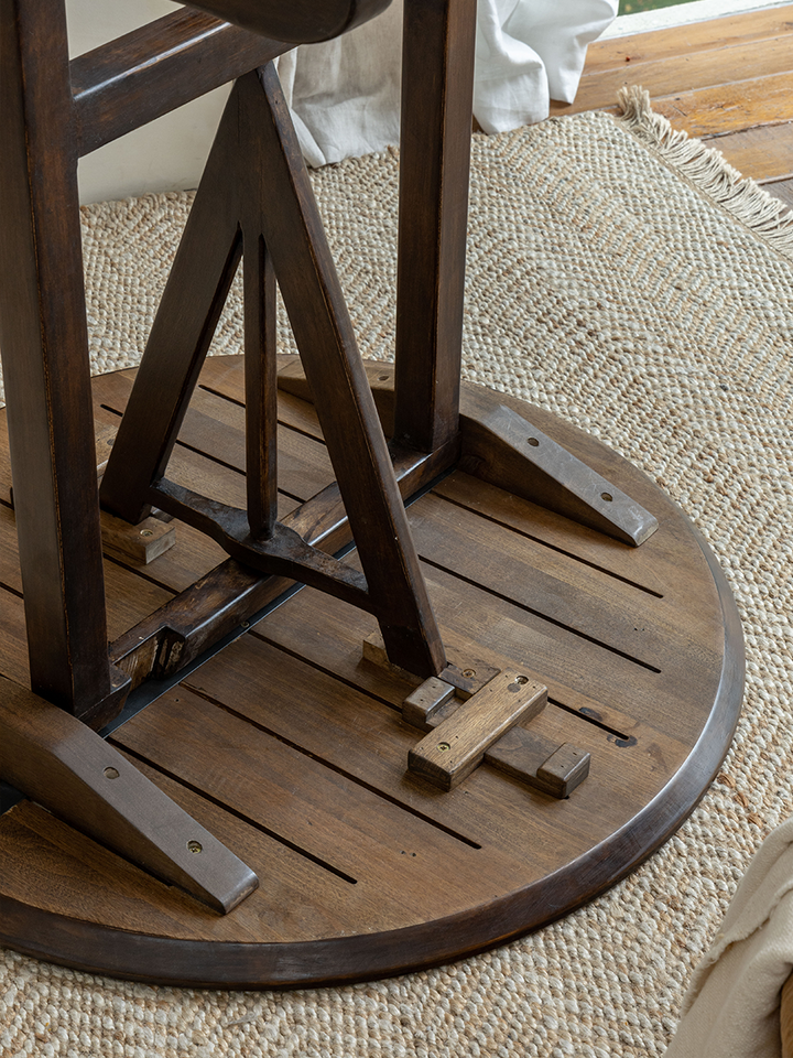 V-Leg Round Table close-up featuring foldable design and rich dark wood finish.