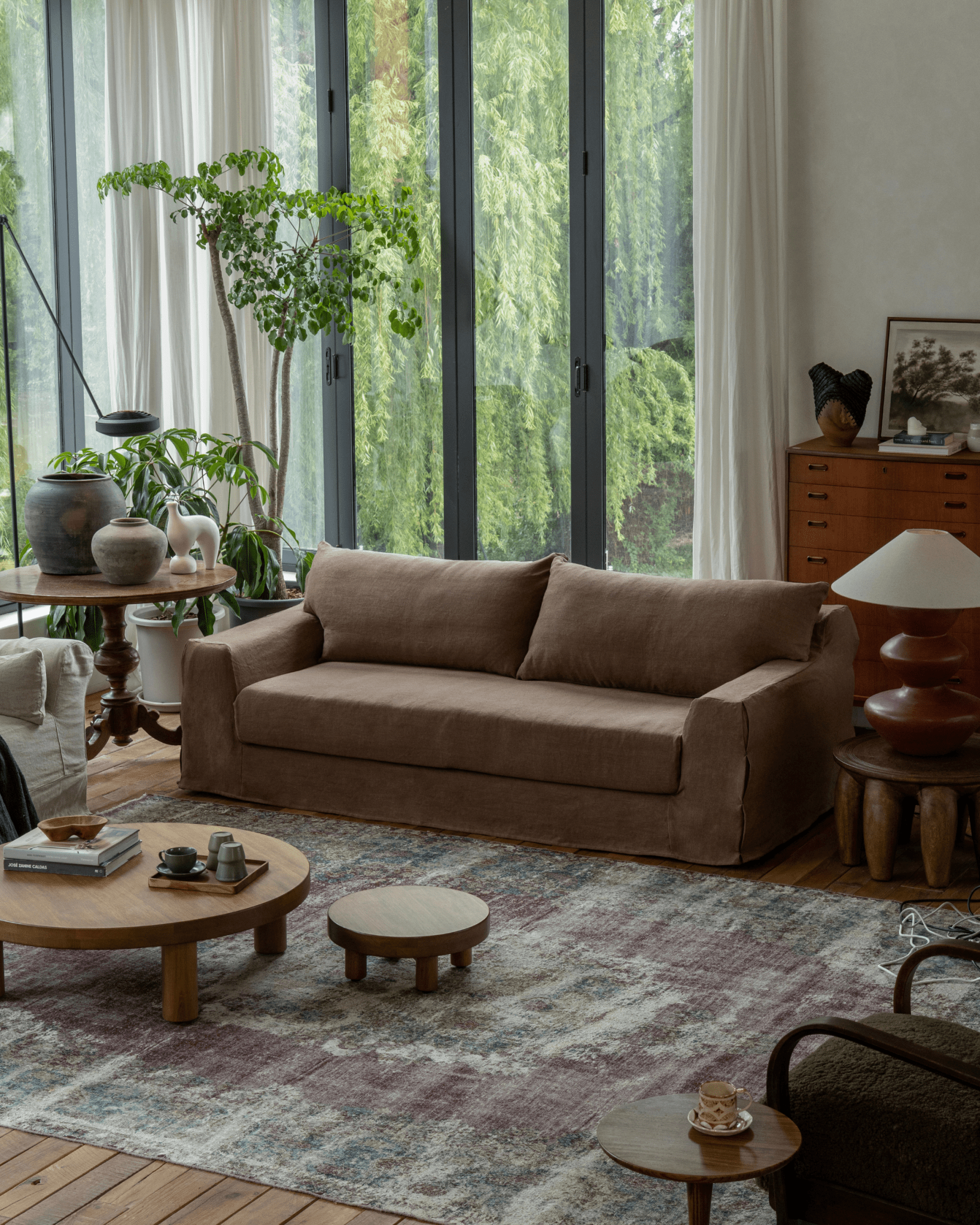 Terracotta Guni Linen Sofa in cozy living room setting, linen fabric, natural textures and wooden furniture