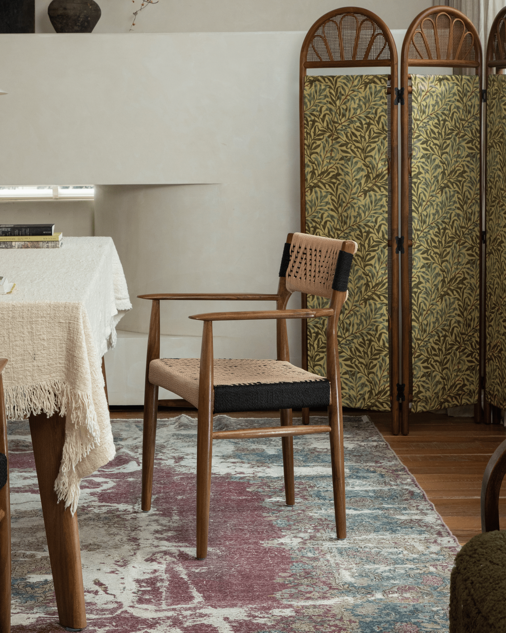 Milazzo Dining Chair in interior setting, teak wood frame, handwoven PVC rope seat