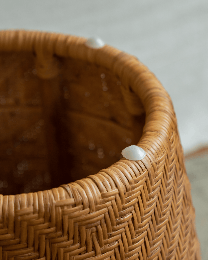 Close-up of Drum Rattan Side Table showcasing handwoven texture and smooth finish.