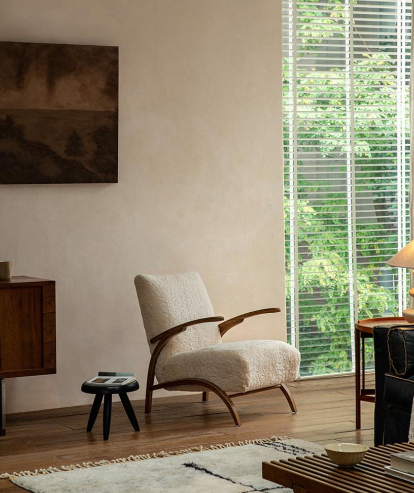 Nebula Lounge Chair with shearling upholstery and red oak frame, mid-century modern living room design