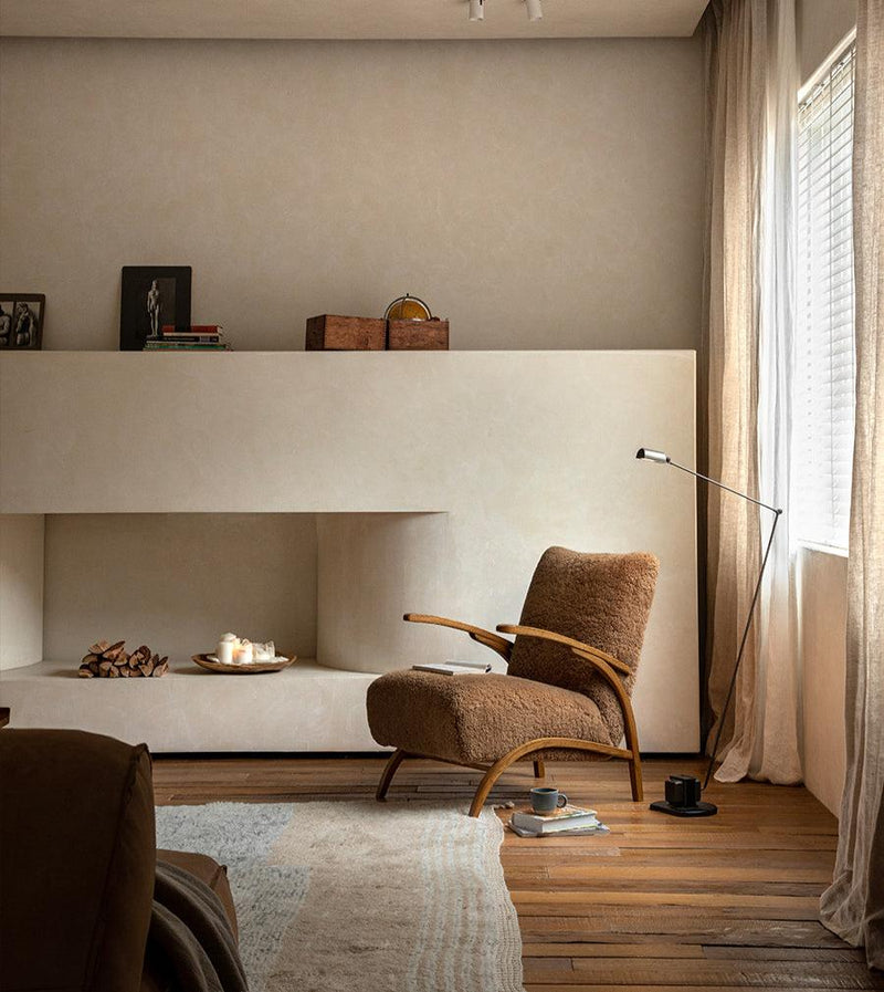 Nebula Lounge Chair in a cozy living room with natural light and minimalist decor