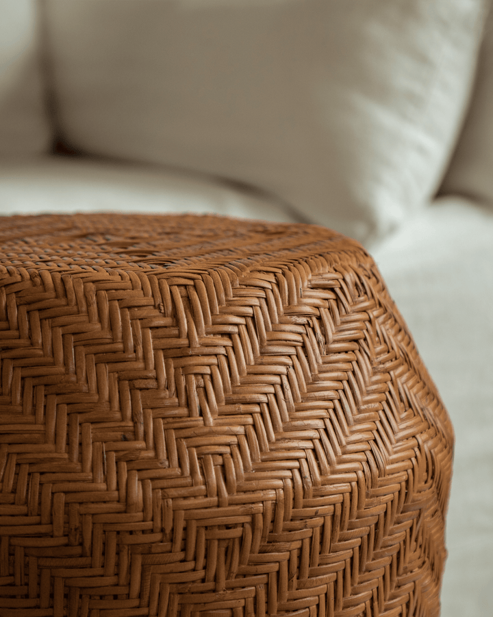 Close-up of Drum Rattan Side Table highlighting herringbone weave and smooth texture.