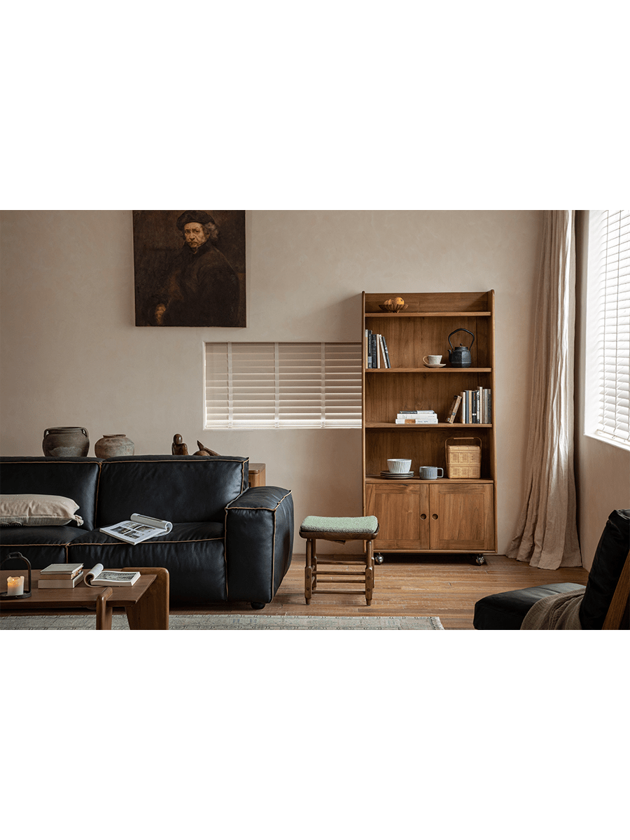 Lidi Display Cabinet styled in a modern living room with teak wood, adjustable shelves, and universal wheels