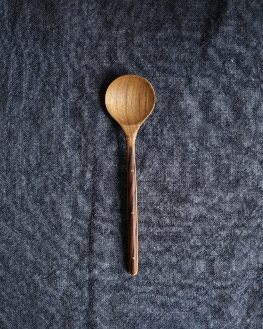 Ebony wood handle table spoon with swirled teak pattern and dots