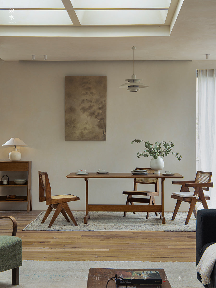 Hoof Dining Table in a cozy dining setting with I-shaped base, solid wood, ZHUOMU brand, woven chairs and bench