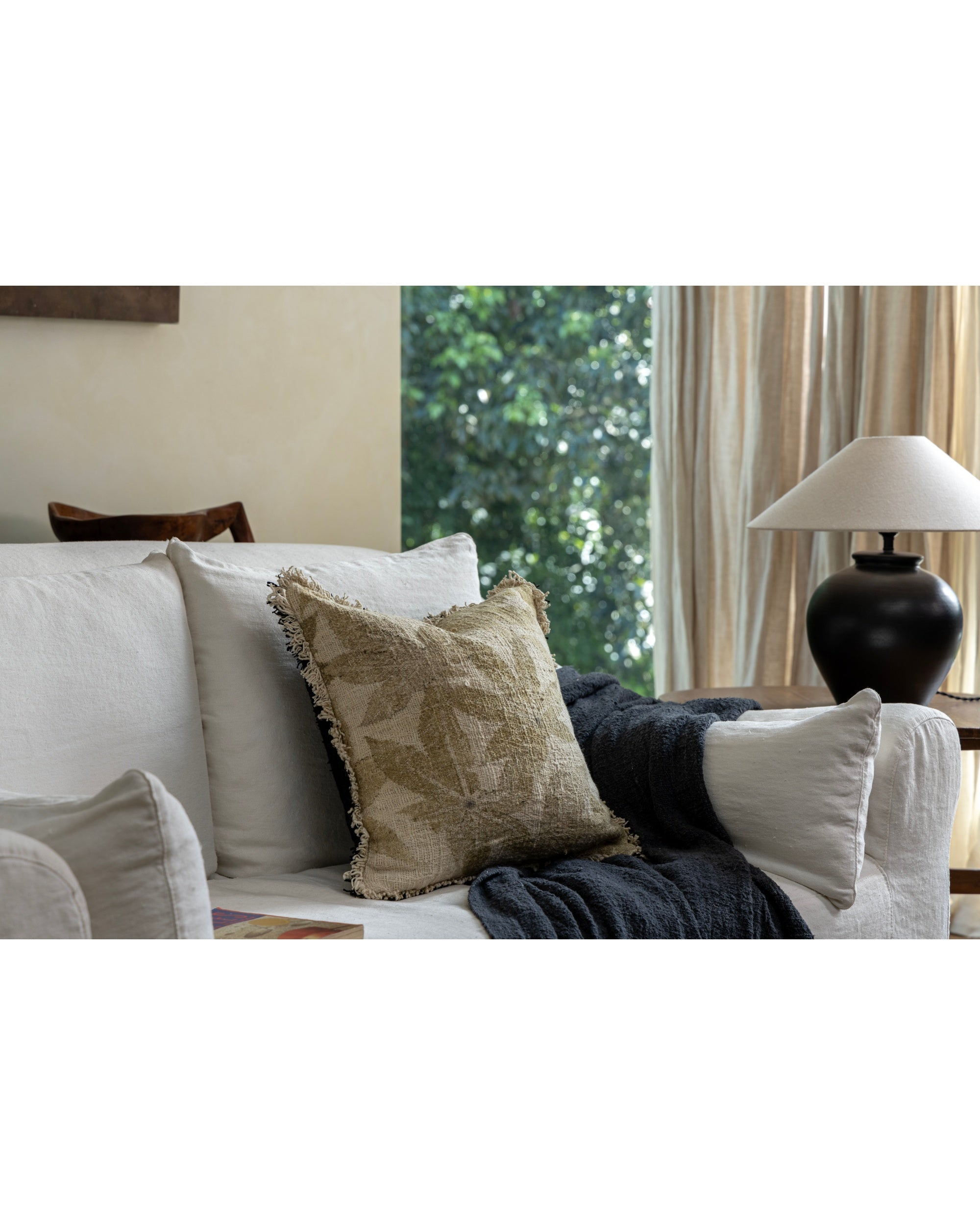 Verda Pillow: hand-crocheted cotton, neutral tone, organic plant print, fringe.
