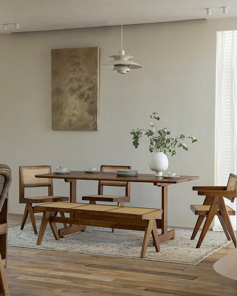 Hoof Dining Table in a cozy dining room setting, solid wood with I-shaped base, rattan chairs and bench, ZHUOMU brand