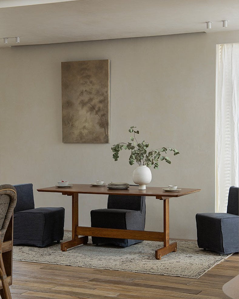 Hoof Dining Table in a cozy dining setting with solid wood, I-shaped base, and dark blue chairs, ZHUOMU brand