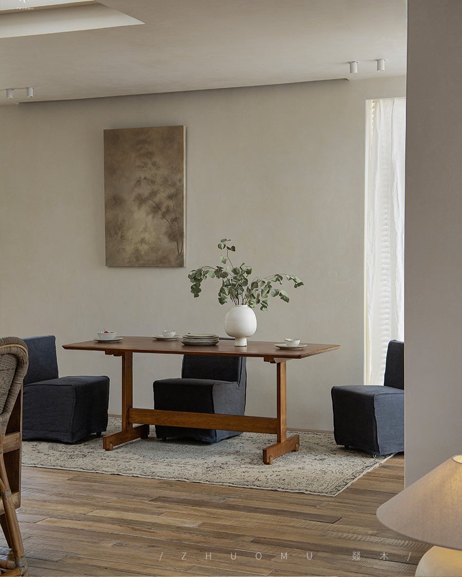 Hoof Dining Table in a cozy dining setting with solid wood, I-shaped base, and dark blue chairs, ZHUOMU brand