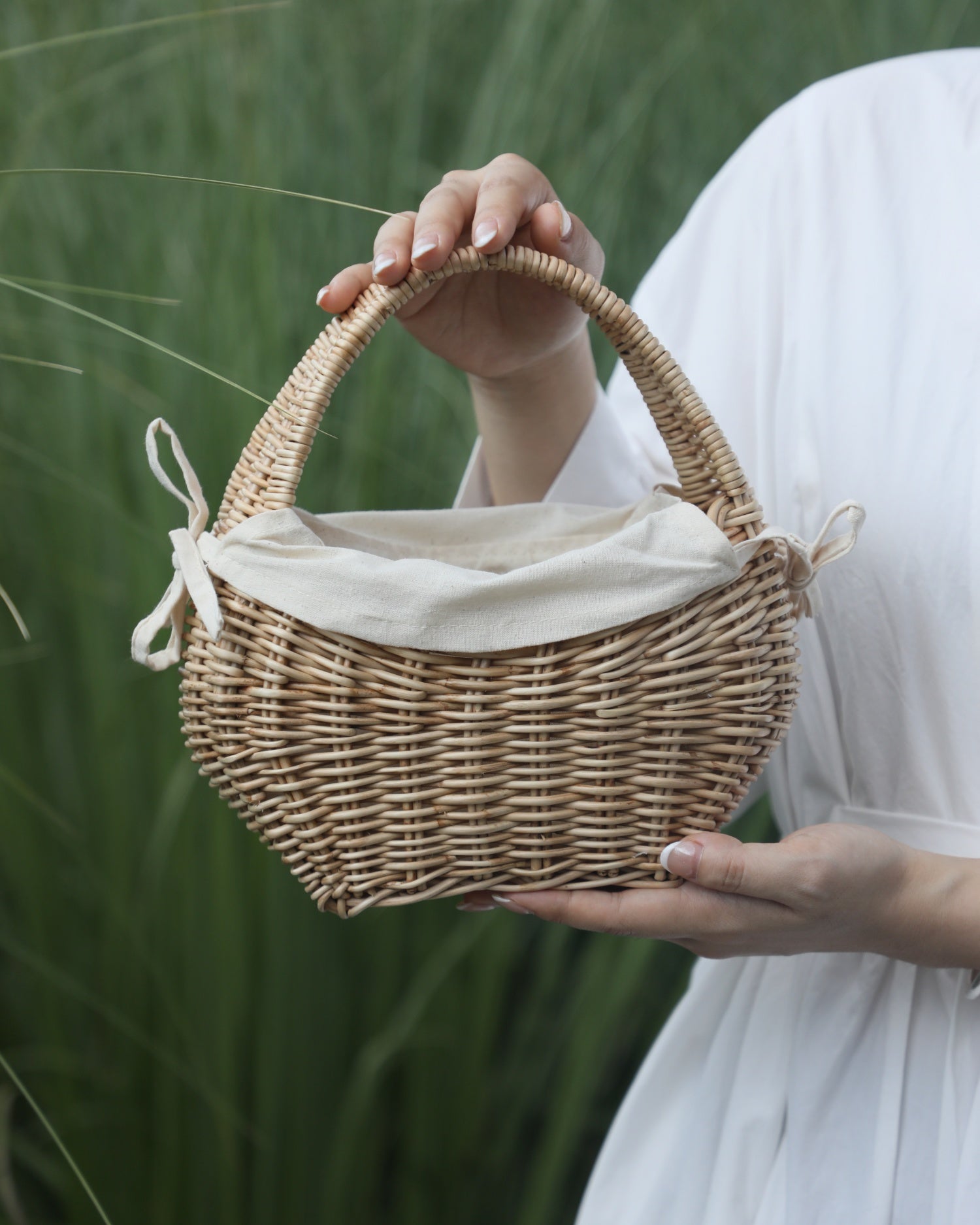 Nora Clutch: Woven rattan basket with cotton lining, perfect for cosmetics/stationery.