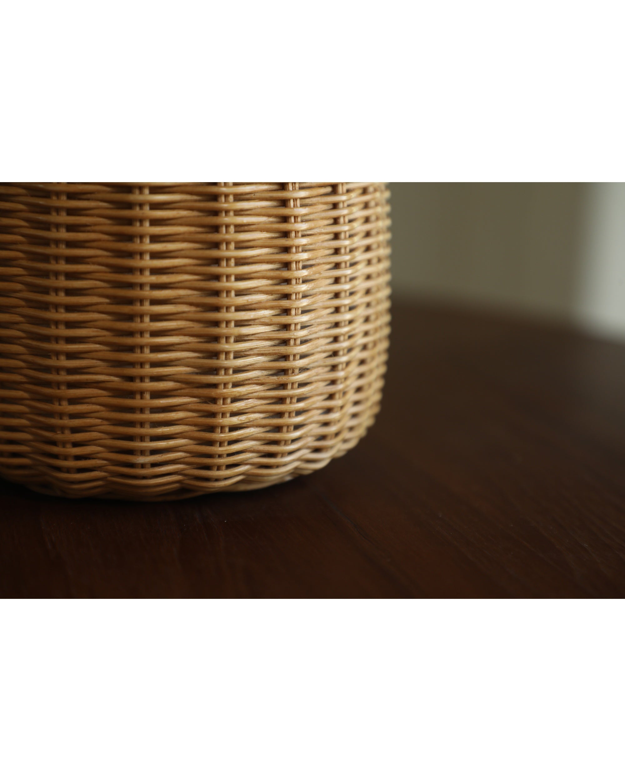 Natural rattan woven texture detail of Elodie Round Storage Basket.