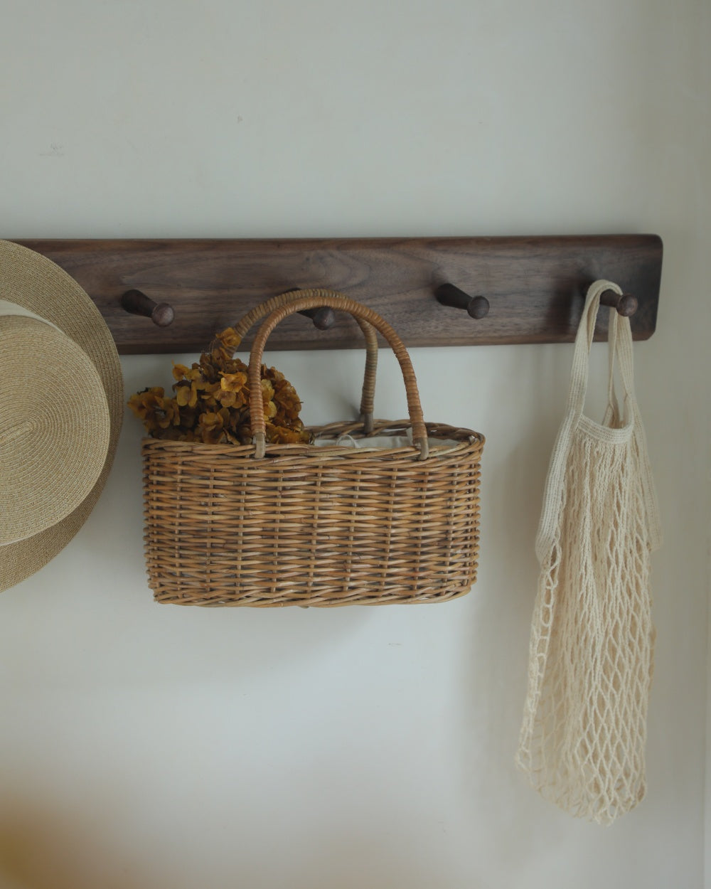 Natural rattan Ann handbag with woven handle and rectangular basket shape