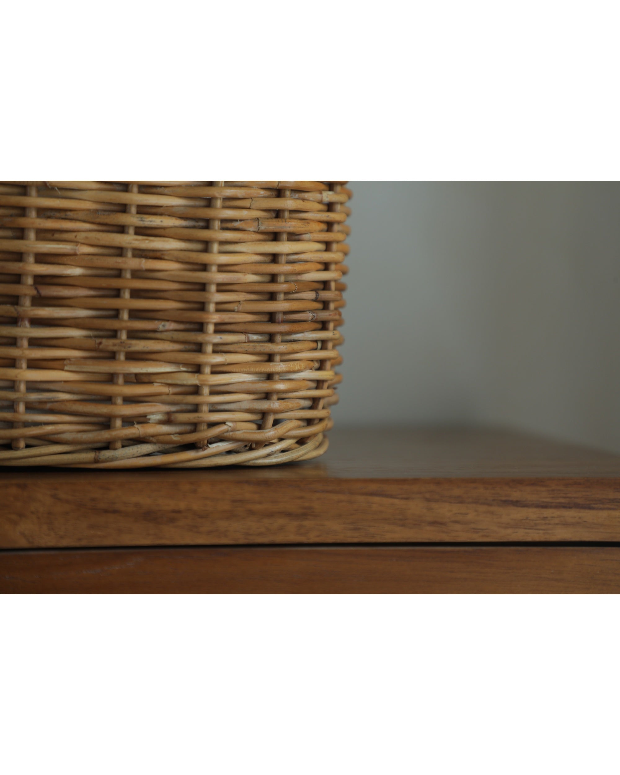 Close-up of natural woven rattan handbag, handmade basket texture