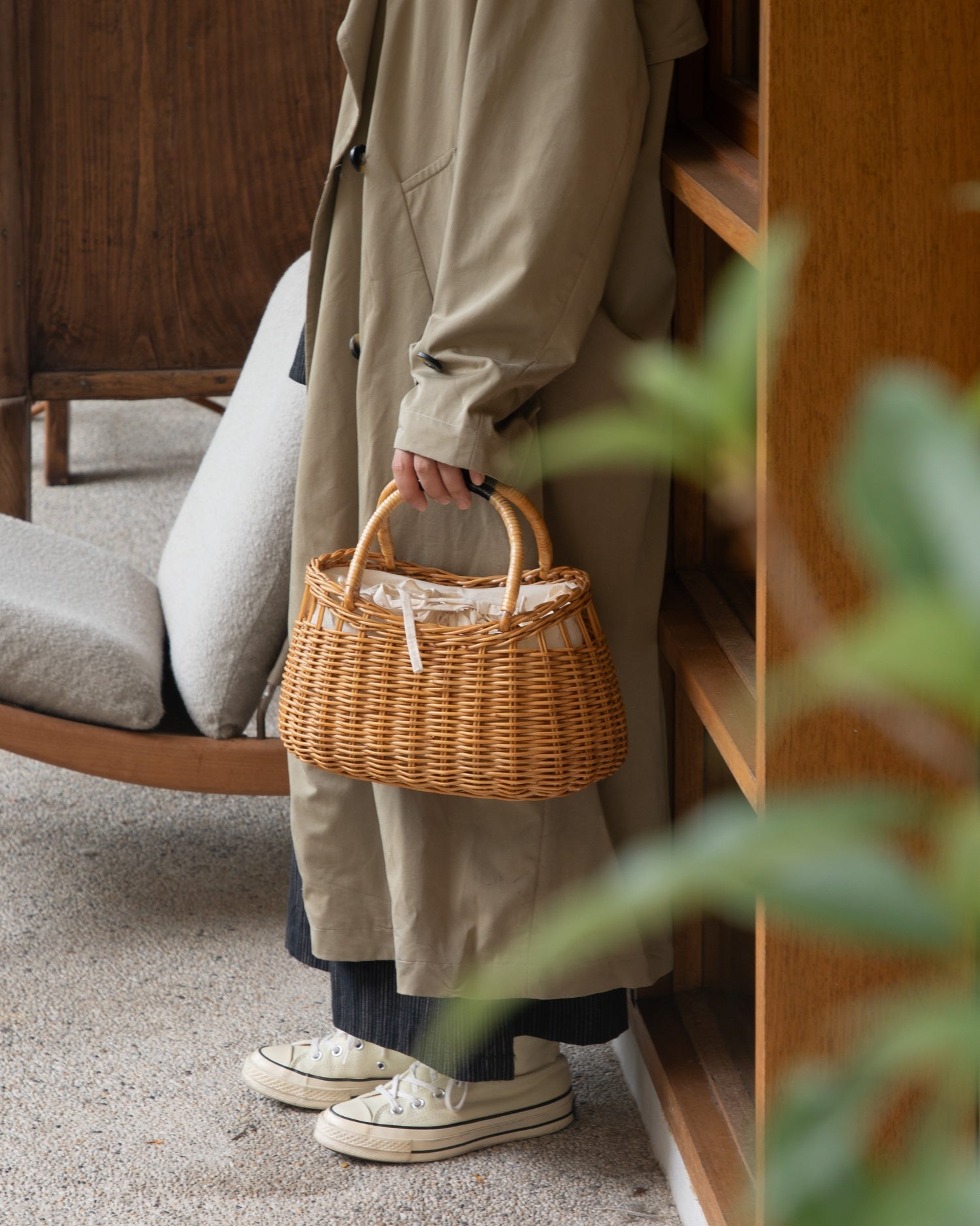Ivy Hand Bag, woven rattan basket with dual top handles and drawstring closure.