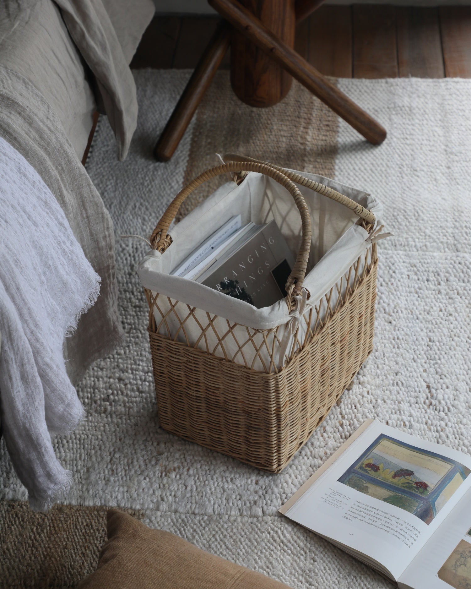 Lina Basket: Woven rattan storage basket, dual-texture weave, cream lining, handles.