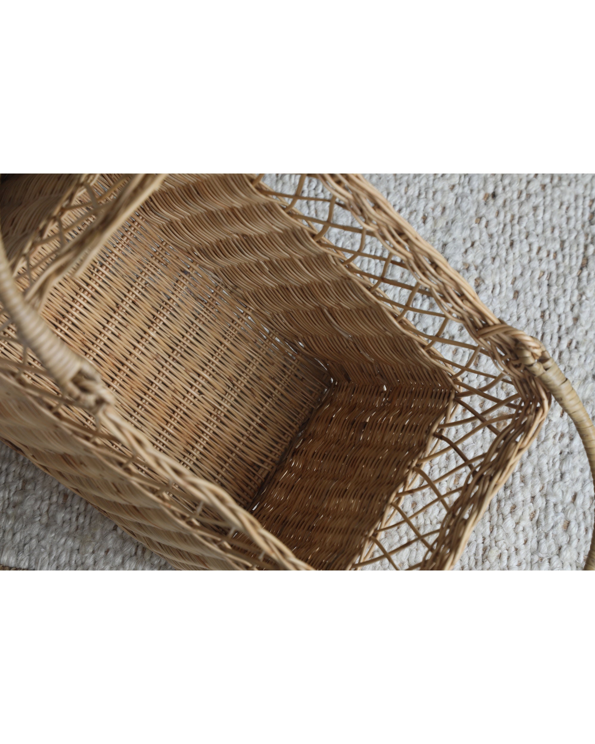 Lina Basket: Natural woven rattan rectangular basket with unique dual-texture weave and curved handles.
