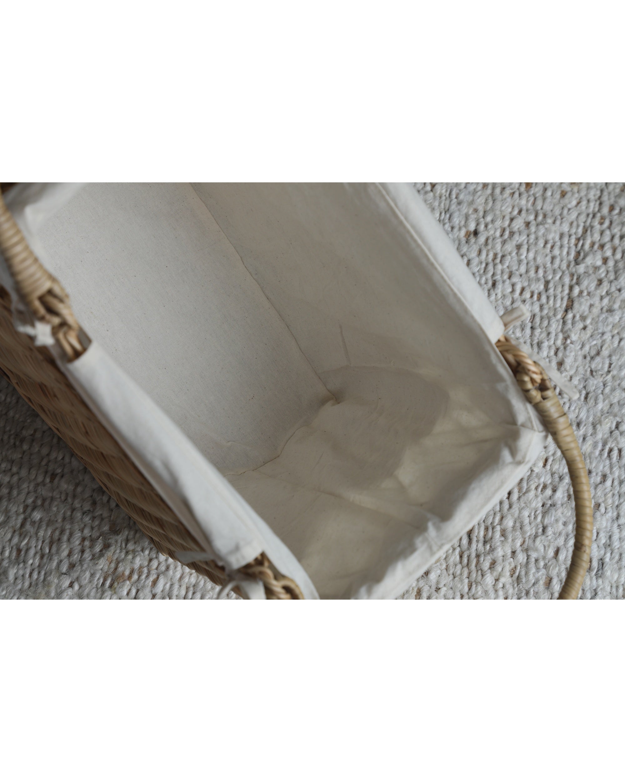 Lina Basket interior with beige cotton lining and woven rattan handles.