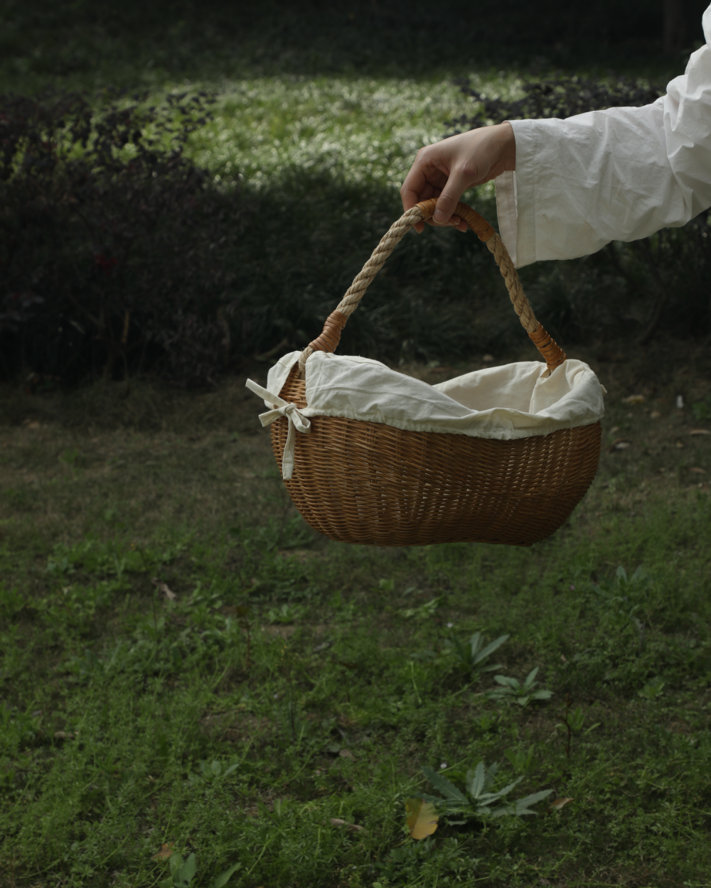 Handwoven Aurelia Basket with rope handle and removable white lining