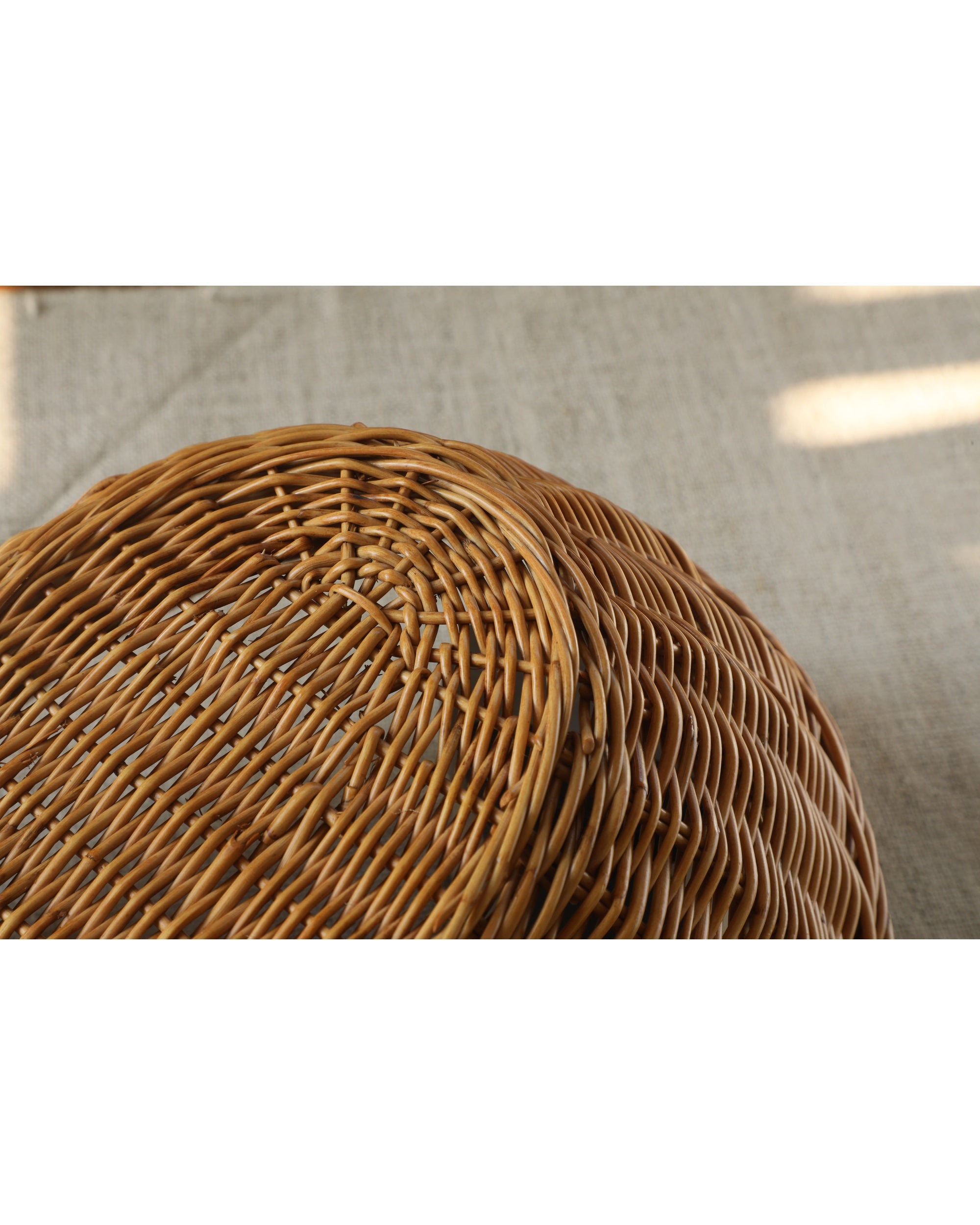 Natural rattan Dottie Basket with detailed woven texture, organic home decor.