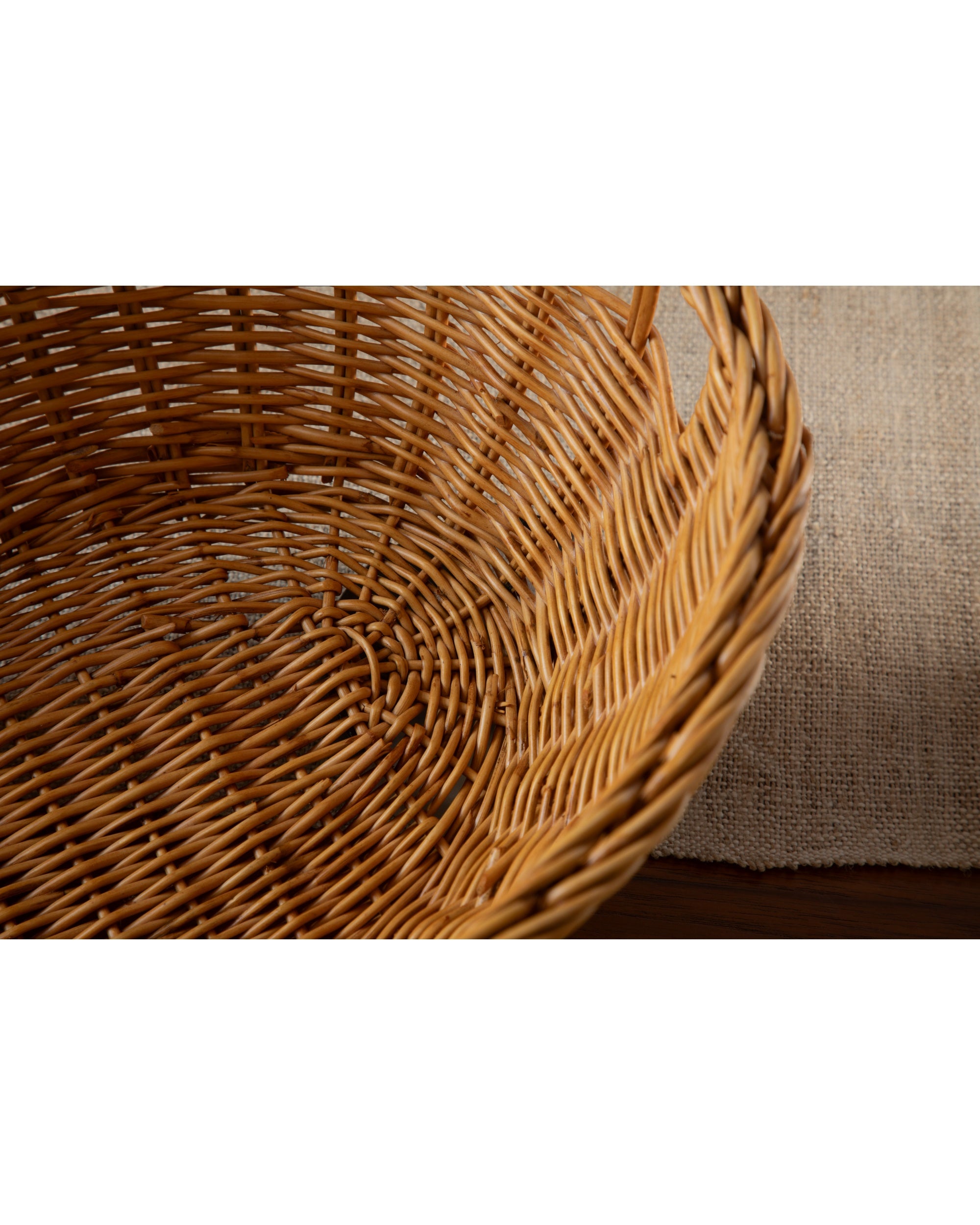 Dottie woven basket, hand-crafted from natural rattan with rustic texture.