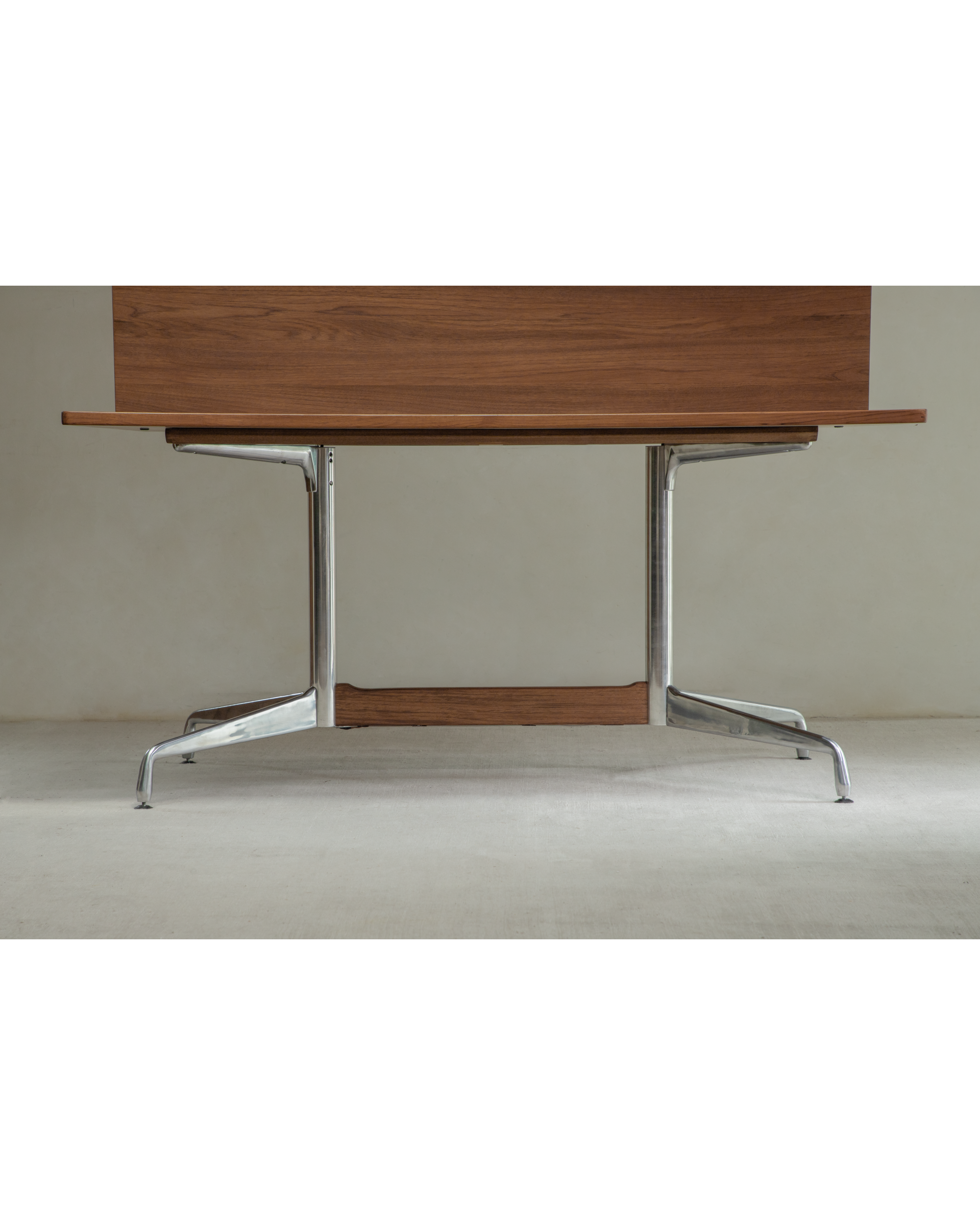 Detail of Evan Office Desk: polished aluminum alloy legs supporting teak wood structure and top.